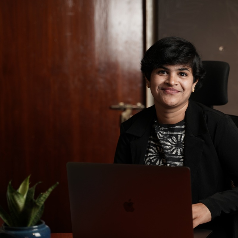Dr. Sandhya Ravi (PT) - Working at Desk